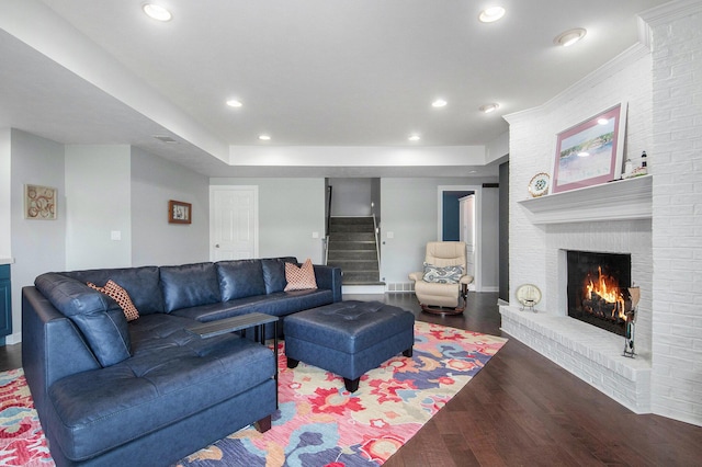 172 Bay Meadows Dr, Holland, MI 49424 - living room with a fireplace, stairs, wood finished floors, and recessed lighting