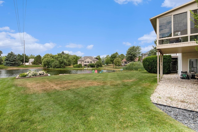 172 Bay Meadows Dr, Holland, MI 49424 - view of grassy yard featuring a water view and a sunroom