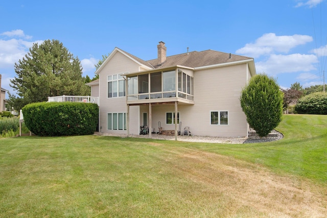172 Bay Meadows Dr, Holland, MI 49424 - rear view of house featuring a chimney, a sunroom, and a yard