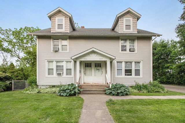 1019/1021 N Michigan Ave, Howell, MI 48843 - american foursquare style home featuring cooling unit and roof with shingles