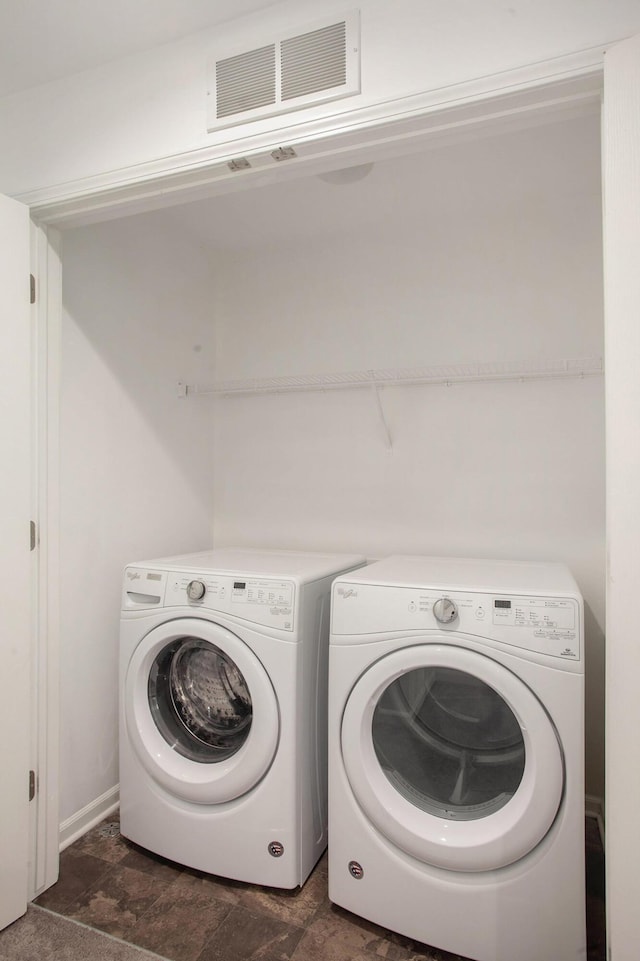 2817 Hartwick Dr, Rochester Hills, MI 48307 - laundry room with washing machine and dryer and stone finish floors