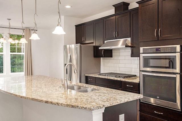 2817 Hartwick Dr, Rochester Hills, MI 48307 - kitchen featuring stainless steel appliances, tasteful backsplash, dark brown cabinets, and under cabinet range hood