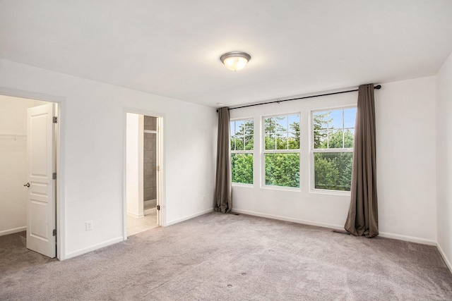 2817 Hartwick Dr, Rochester Hills, MI 48307 - unfurnished bedroom with a walk in closet, carpet floors, and connected bathroom