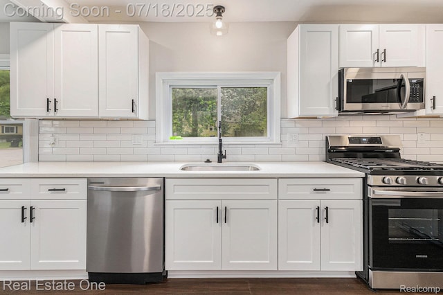 21801 Colgate St, Farmington Hills, MI 48336 - kitchen with appliances with stainless steel finishes, white cabinets, healthy amount of natural light, and light countertops