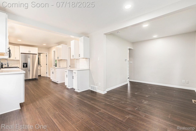 21801 Colgate St, Farmington Hills, MI 48336 - kitchen featuring stainless steel fridge with ice dispenser, decorative backsplash, light countertops, white cabinets, and recessed lighting