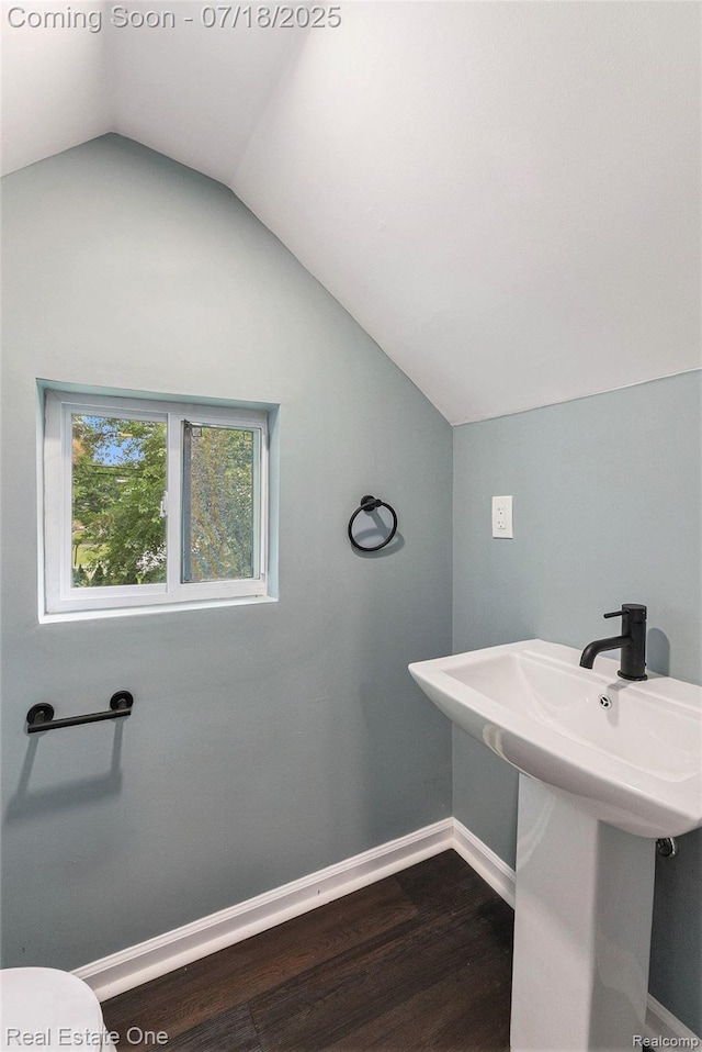 21801 Colgate St, Farmington Hills, MI 48336 - bathroom featuring lofted ceiling and wood finished floors