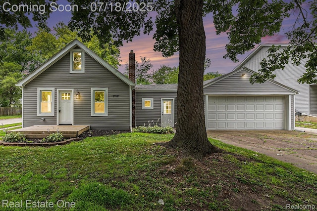 21801 Colgate St, Farmington Hills, MI 48336 - view of front of home featuring driveway, a chimney, an attached garage, and a lawn