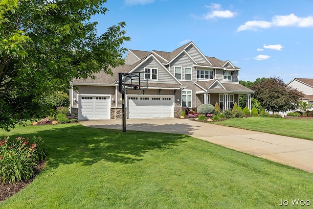 5362 Settlers Grove Rd NE, Belmont, MI 49306 - view of front of property featuring stone siding, driveway, and a front yard