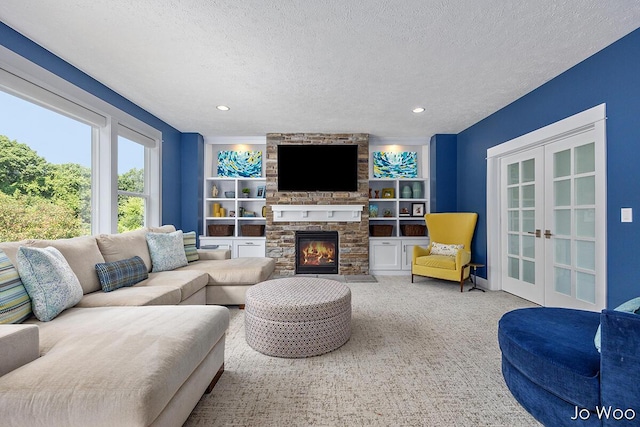 5362 Settlers Grove Rd NE, Belmont, MI 49306 - living room with a textured ceiling, french doors, carpet, a fireplace, and recessed lighting
