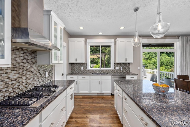 5362 Settlers Grove Rd NE, Belmont, MI 49306 - kitchen featuring wall chimney exhaust hood, stainless steel appliances, dark wood-style flooring, white cabinets, and recessed lighting