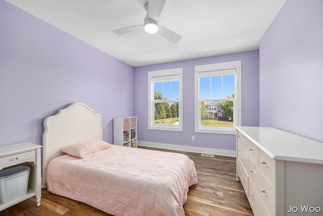 5362 Settlers Grove Rd NE, Belmont, MI 49306 - bedroom with dark wood-type flooring and a ceiling fan