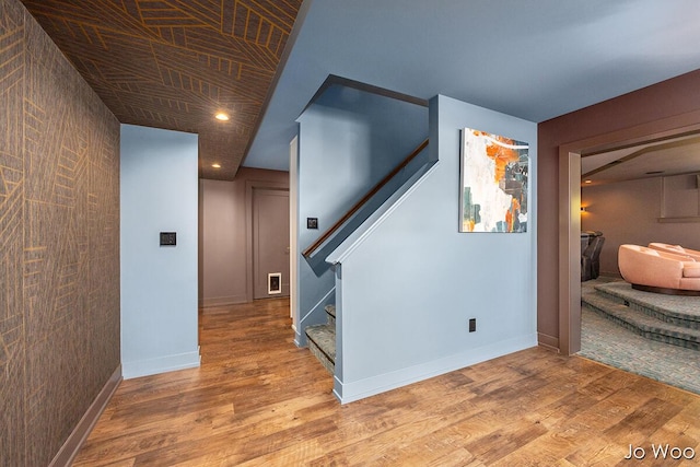 5362 Settlers Grove Rd NE, Belmont, MI 49306 - corridor featuring stairs, wood finished floors, recessed lighting, and an accent wall