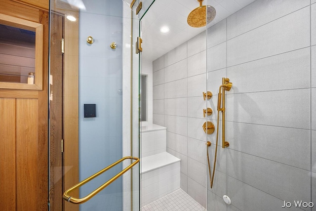5362 Settlers Grove Rd NE, Belmont, MI 49306 - bathroom featuring a shower stall, tile walls, and recessed lighting