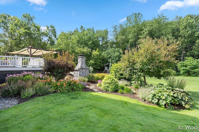 5362 Settlers Grove Rd NE, Belmont, MI 49306 - view of green lawn with a wooden deck