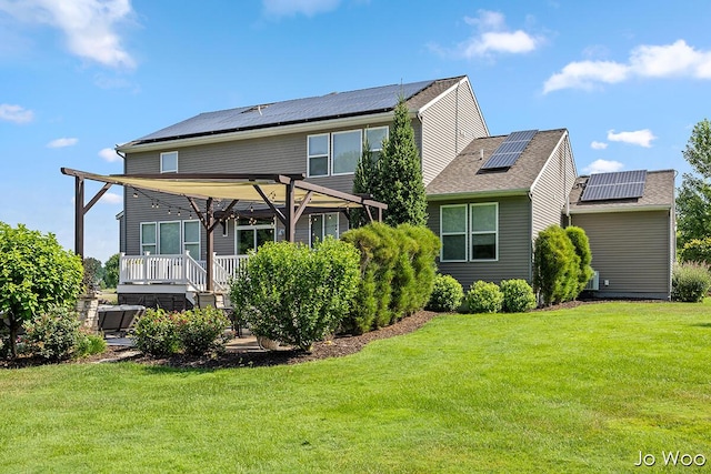 5362 Settlers Grove Rd NE, Belmont, MI 49306 - back of house featuring a pergola, a lawn, and roof mounted solar panels