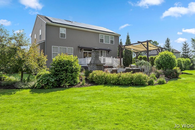 5362 Settlers Grove Rd NE, Belmont, MI 49306 - back of house featuring solar panels, a yard, outdoor lounge area, and a wooden deck