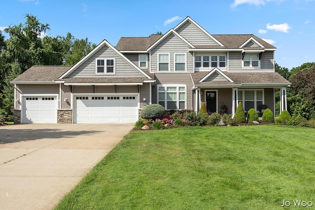 5362 Settlers Grove Rd NE, Belmont, MI 49306 - craftsman-style house with a front lawn, concrete driveway, an attached garage, and a shingled roof