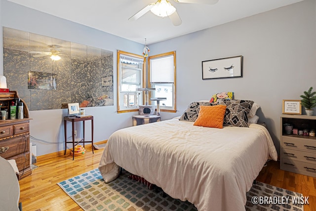 302 W 22nd St, Holland, MI 49423 - bedroom with wood finished floors and ceiling fan
