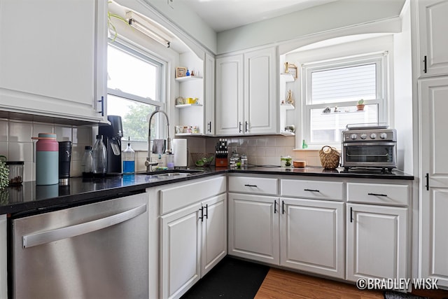 302 W 22nd St, Holland, MI 49423 - kitchen with dishwasher, open shelves, dark countertops, white cabinets, and backsplash