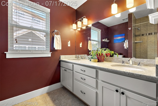 1120 Wyandotte Ave, Royal Oak, MI 48067 - full bathroom with tile patterned flooring, healthy amount of natural light, double vanity, and tiled shower