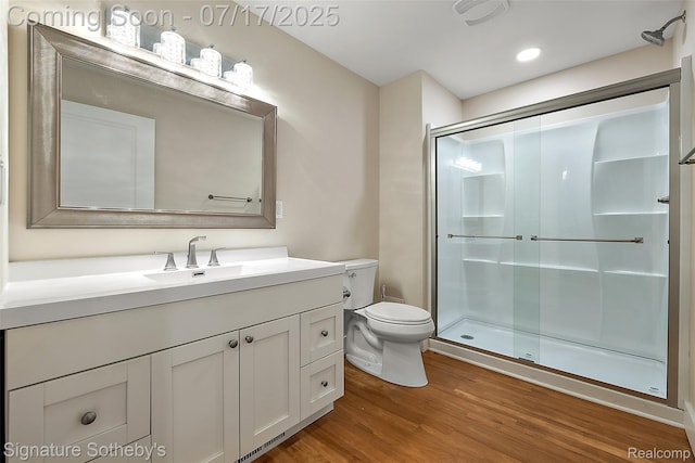 1120 Wyandotte Ave, Royal Oak, MI 48067 - bathroom featuring wood finished floors, a shower stall, vanity, and recessed lighting
