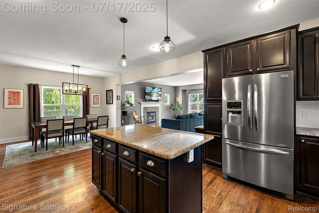 1120 Wyandotte Ave, Royal Oak, MI 48067 - kitchen featuring stainless steel fridge with ice dispenser, plenty of natural light, dark wood-style floors, and a chandelier