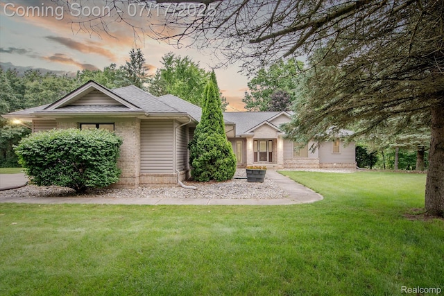 1847 Brandy Ln, Brighton, MI 48114 - view of front of house with a yard and roof with shingles