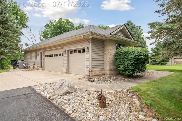 1847 Brandy Ln, Brighton, MI 48114 - view of side of property featuring driveway, a garage, roof with shingles, and a yard