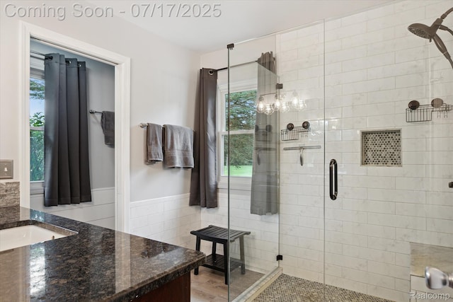 1847 Brandy Ln, Brighton, MI 48114 - full bath featuring vanity, a shower stall, wainscoting, and tile walls