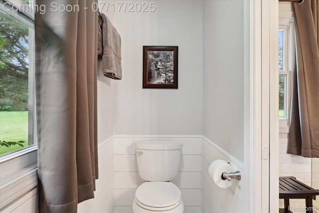 1847 Brandy Ln, Brighton, MI 48114 - bathroom with wainscoting and plenty of natural light