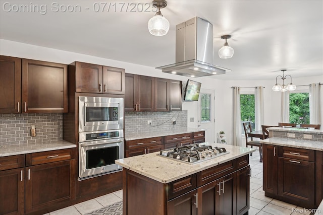 1847 Brandy Ln, Brighton, MI 48114 - kitchen with light tile patterned flooring, island range hood, stainless steel appliances, and backsplash