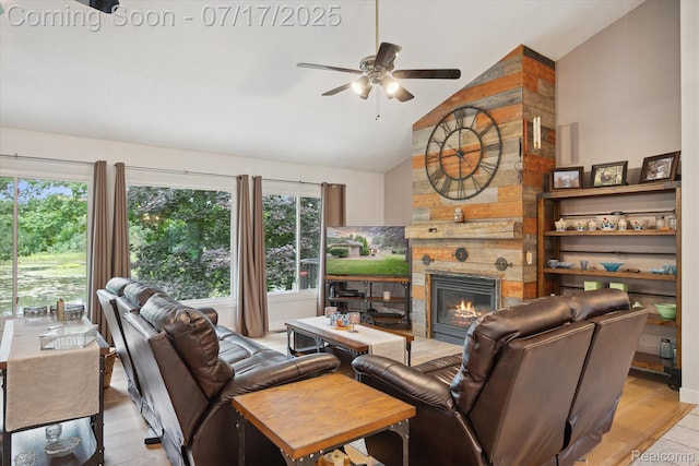 1847 Brandy Ln, Brighton, MI 48114 - living room with vaulted ceiling, a ceiling fan, a fireplace, and light wood finished floors