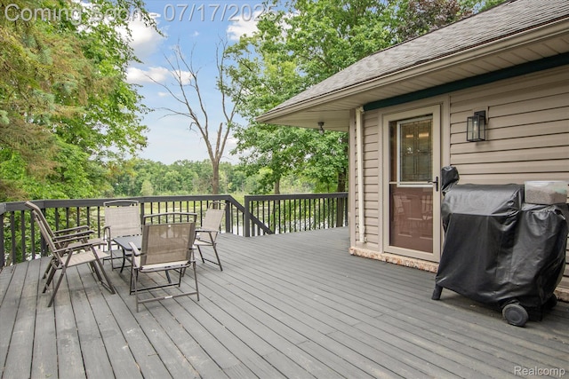 1847 Brandy Ln, Brighton, MI 48114 - wooden terrace with outdoor dining area and area for grilling