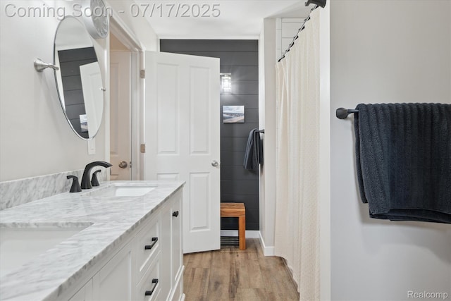 1847 Brandy Ln, Brighton, MI 48114 - full bathroom with wood finished floors, double vanity, and curtained shower