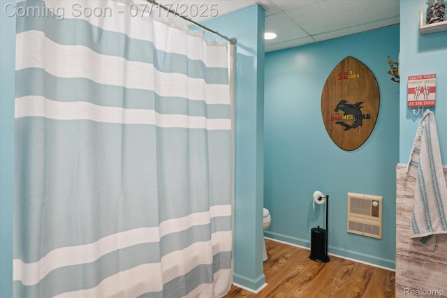 1847 Brandy Ln, Brighton, MI 48114 - full bathroom with wood finished floors, heating unit, curtained shower, and a drop ceiling
