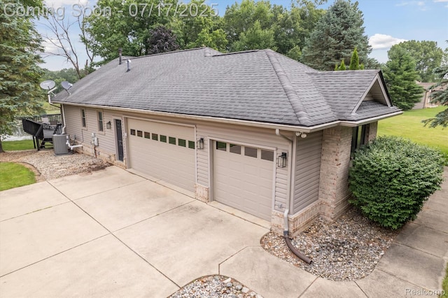 1847 Brandy Ln, Brighton, MI 48114 - garage with concrete driveway