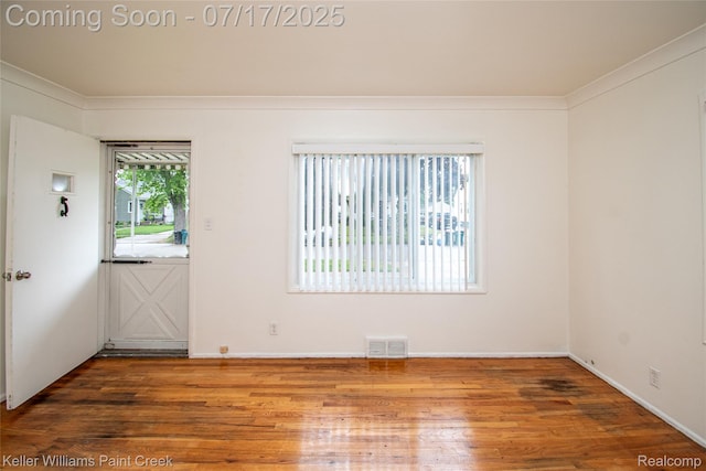 43 Charlevoix St, Clawson, MI 48017 - spare room with wood finished floors and ornamental molding