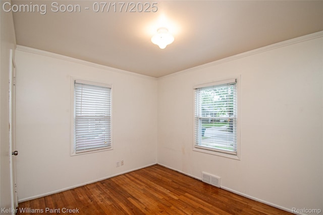 43 Charlevoix St, Clawson, MI 48017 - empty room with wood finished floors and crown molding