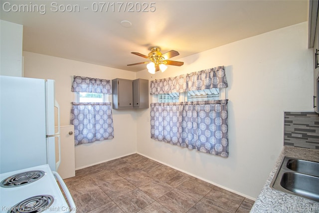 43 Charlevoix St, Clawson, MI 48017 - kitchen with white appliances, a ceiling fan, gray cabinetry, and light countertops