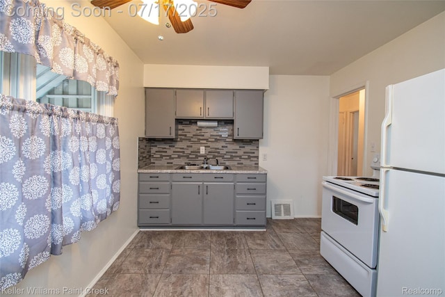 43 Charlevoix St, Clawson, MI 48017 - kitchen featuring white appliances, gray cabinets, a ceiling fan, tasteful backsplash, and light countertops