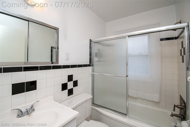 43 Charlevoix St, Clawson, MI 48017 - full bathroom with bath / shower combo with glass door, tile walls, and vanity