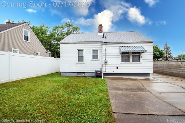 43 Charlevoix St, Clawson, MI 48017 - rear view of property with a chimney, roof with shingles, and a patio