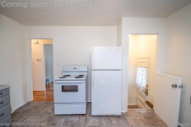 43 Charlevoix St, Clawson, MI 48017 - kitchen featuring white appliances, gray cabinets, and light countertops