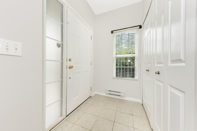 241 W Oakbrook Dr, Ann Arbor, MI 48103 - doorway with light tile patterned floors and a baseboard radiator