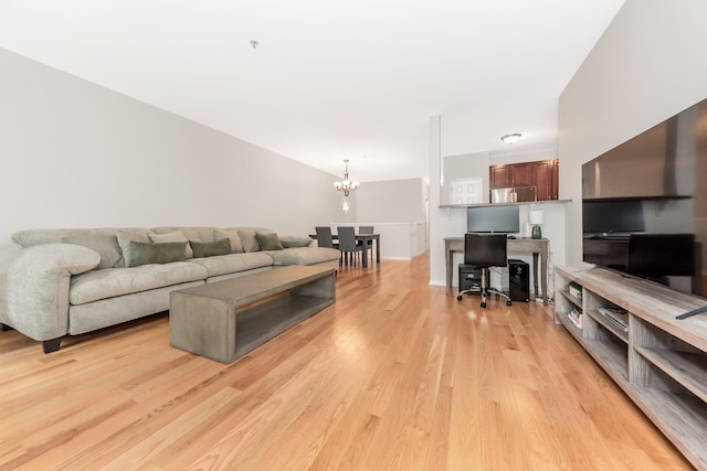 241 W Oakbrook Dr, Ann Arbor, MI 48103 - living area with a chandelier and light wood-type flooring