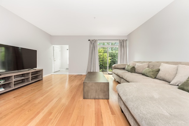 241 W Oakbrook Dr, Ann Arbor, MI 48103 - living area featuring light wood-style flooring and baseboards