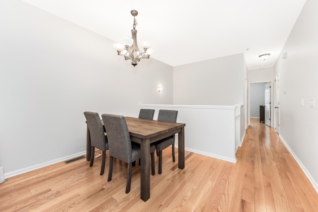 241 W Oakbrook Dr, Ann Arbor, MI 48103 - dining space featuring a chandelier and light wood finished floors