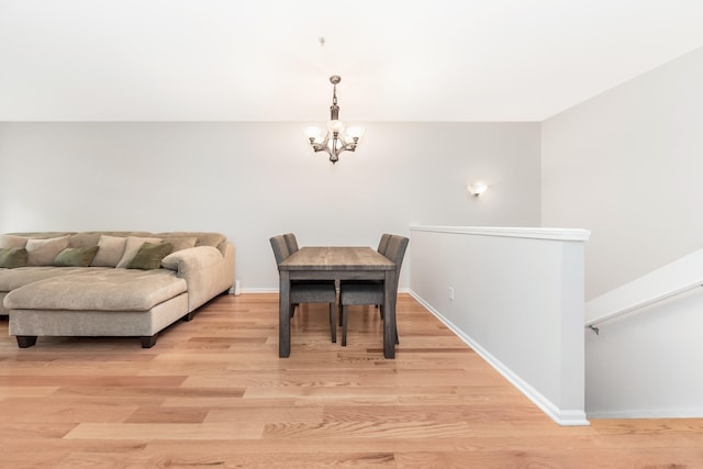 241 W Oakbrook Dr, Ann Arbor, MI 48103 - dining area featuring a chandelier and light wood finished floors
