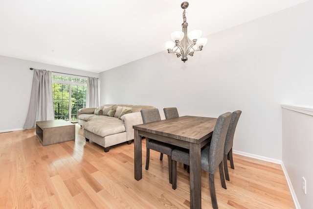241 W Oakbrook Dr, Ann Arbor, MI 48103 - dining space featuring a chandelier and light wood-style flooring