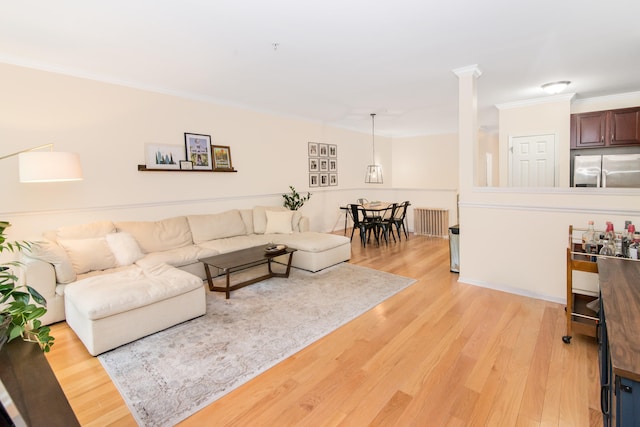 225 W Oakbrook Dr, Ann Arbor, MI 48103 - living room featuring ornamental molding and light wood-style floors